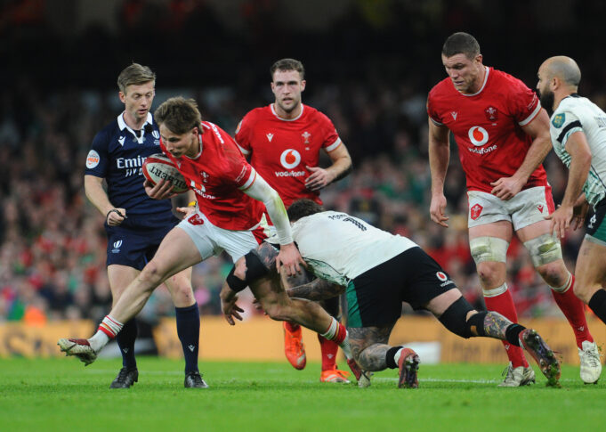 Wales’ Ellis Mee is tackled by Irish players during the February 2025 Six Nations match.