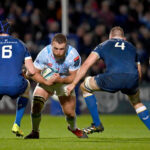 Gerhard Steenekamp of the Bulls carries the ball into contact with Leinster's Ryan Baird and Ross Molony.