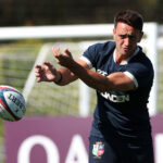 Alex Mitchell throws a pass during a British & Irish Lions training session