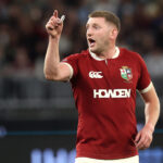 Finn Russell gesticulates with teammates during the British & Irish Lions' 2025 match against Western Force in Perth.