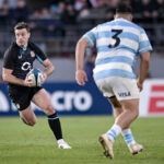England's George Ford runs with the ball during the 5 July Test match against Argentina.